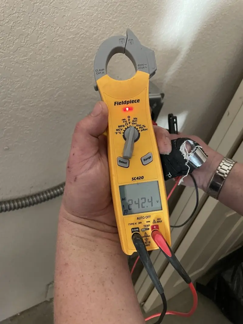 Voltage testing with clamp meter during Ceiling Fan Installation in Chino Valley